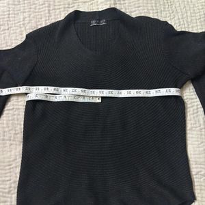 A Classic Black Crewneck Sweater