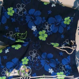 DISNEY Floral mens swimming Costume/ Beach Shorts