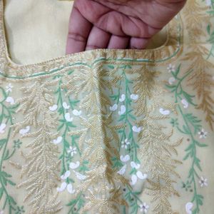 Light yellow embroidery design with square neck