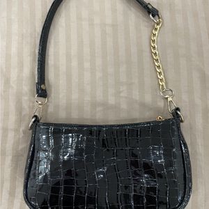 Black Leather Bag With Golden Details