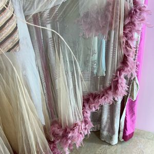 Pink Gown With Net Layer And Feathers