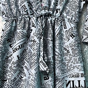 “Chic Newspaper Print Midi Dress with Flared Sleev