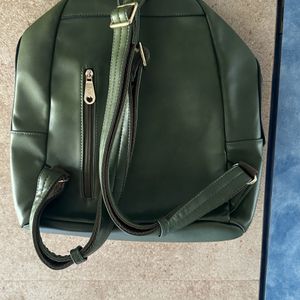 Olive Green Back Pack With Work On It