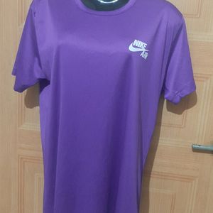 NIKE AIR PURPLE ACTIVE WEAR TSHIRT.