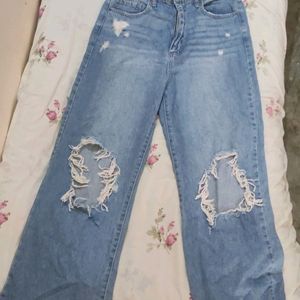 Woman's Torn Jeans