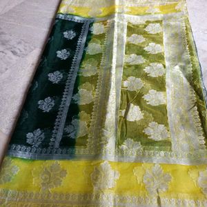 A Bottle Green Colour Saree With Yellow Border