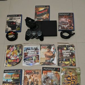 PS2 Console With 11 CD's (Non Working)