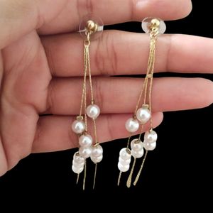 Long White Earrings.