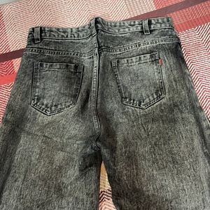 Acid washed distressed black oversized jeans