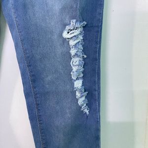 LIGHT BLUE RIPPED JEANS FOR WOMEN