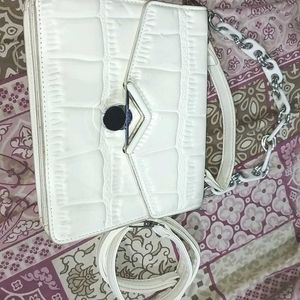 white hand purse