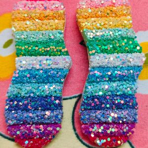 A Pair Of Glittery Rainbow Clips