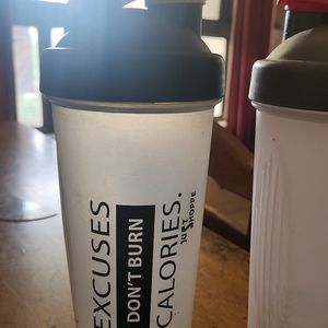 Two Plastic Shakers In Good Condition