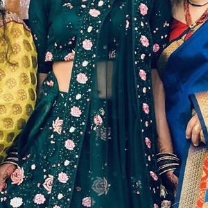 Green colour lehenga with back less blouse