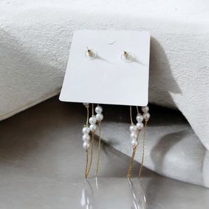 Long White Earrings.