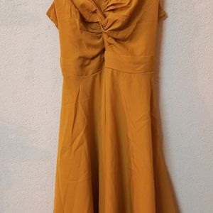 Today's Offer ₹150 Berrylush Women Solid Yellow Front Twist Knot Fit & Flare Mini Dress For Women (Mustard Colour)