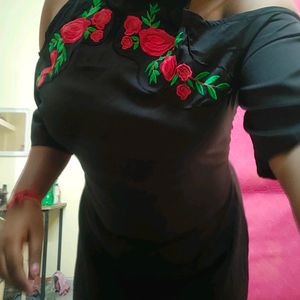 Black cold-shoulder dress with rose embroidery