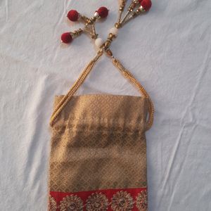 Golden Potli Bag With Red Lace