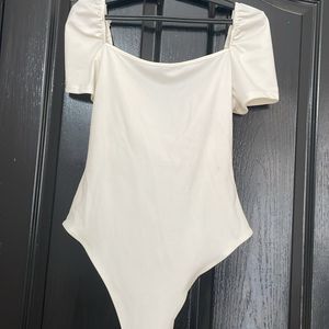 Sexy White low cut body suit