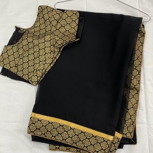 Pretty Black Saree With Golden Border..