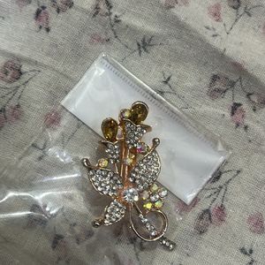 A crystal-studded brooch