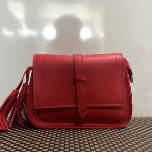 Red Sling Bag With Tassel Detailing