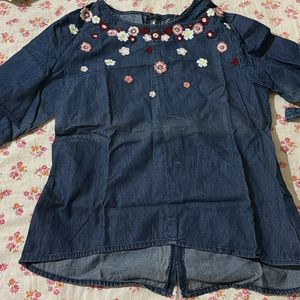top with threaded flowers