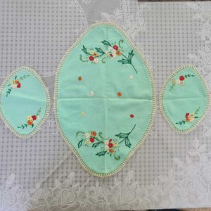 A Set of 3 hand embroidered table mats