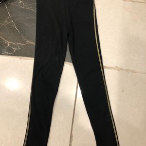 Black Leggings With Golden Striped Sides