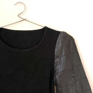 Black Ribbed Top With Puffer Sleeves.