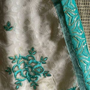 Half Green And White Saree With Stitched Blouse