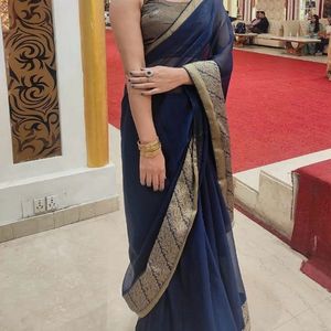 Blue Saree With Gold Borders .