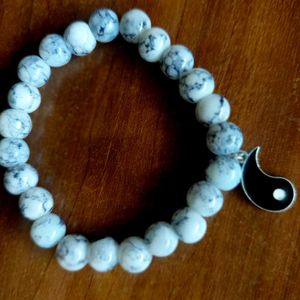 Black + White Beaded Bracelets With Charm.