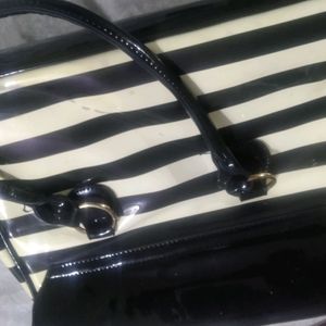 white and black strip handbag