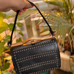 Black embellished sling bag