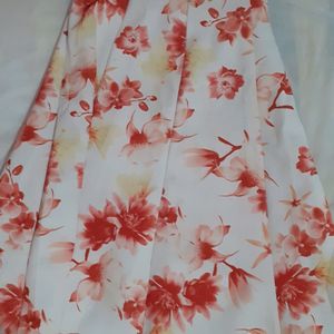 Red top with shoulder design and floral skirt