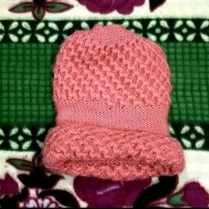 IT IS A PINK COLOR WARM WOOL TOPI.....