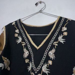 a black embroidery crop top