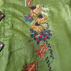 Green Unused Kurti With Embroidery Work With Stones On It