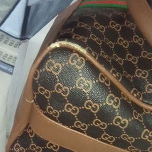 GUCCI DUFFLE HANDY+SLING@390 RS