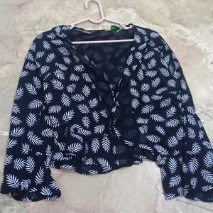 black shrug with leaf print