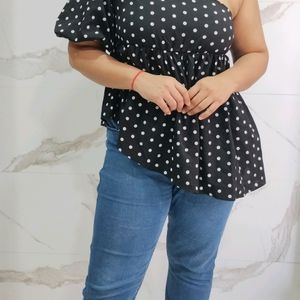 Polka dot printed peplum style top