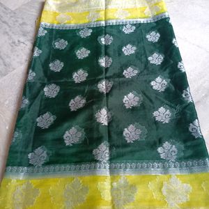 A Bottle Green Colour Saree With Yellow Border