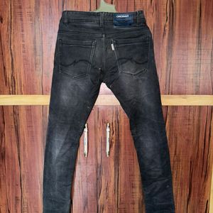 Light black coloured jeans.