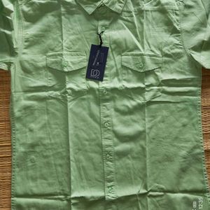 Premium cotton half shirt featuring two pockets.