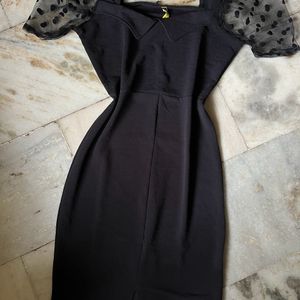 Black bodycon dress with puff sleeves