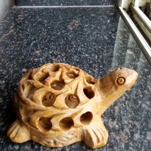 Turtle Carved In Stone With Its Baby