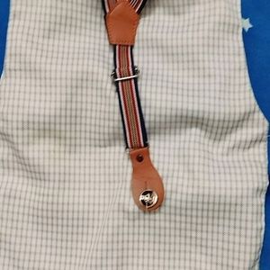 A Chek Jacket With Striped Suspenders