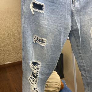 Urbanic ripped straight fit jeans.