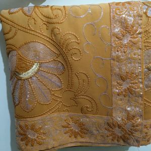 Cream And Orange Embroidery Saree